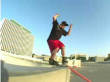 Skater grinds rail and groin