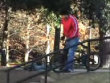 Biker lands face first after grinding rail