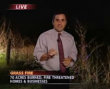 Streaker runs past news reporter