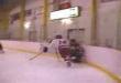 Hockey body check breaks glass